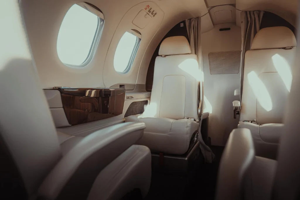 Embraer Phenom 100 interior showcasing premium private aviation services